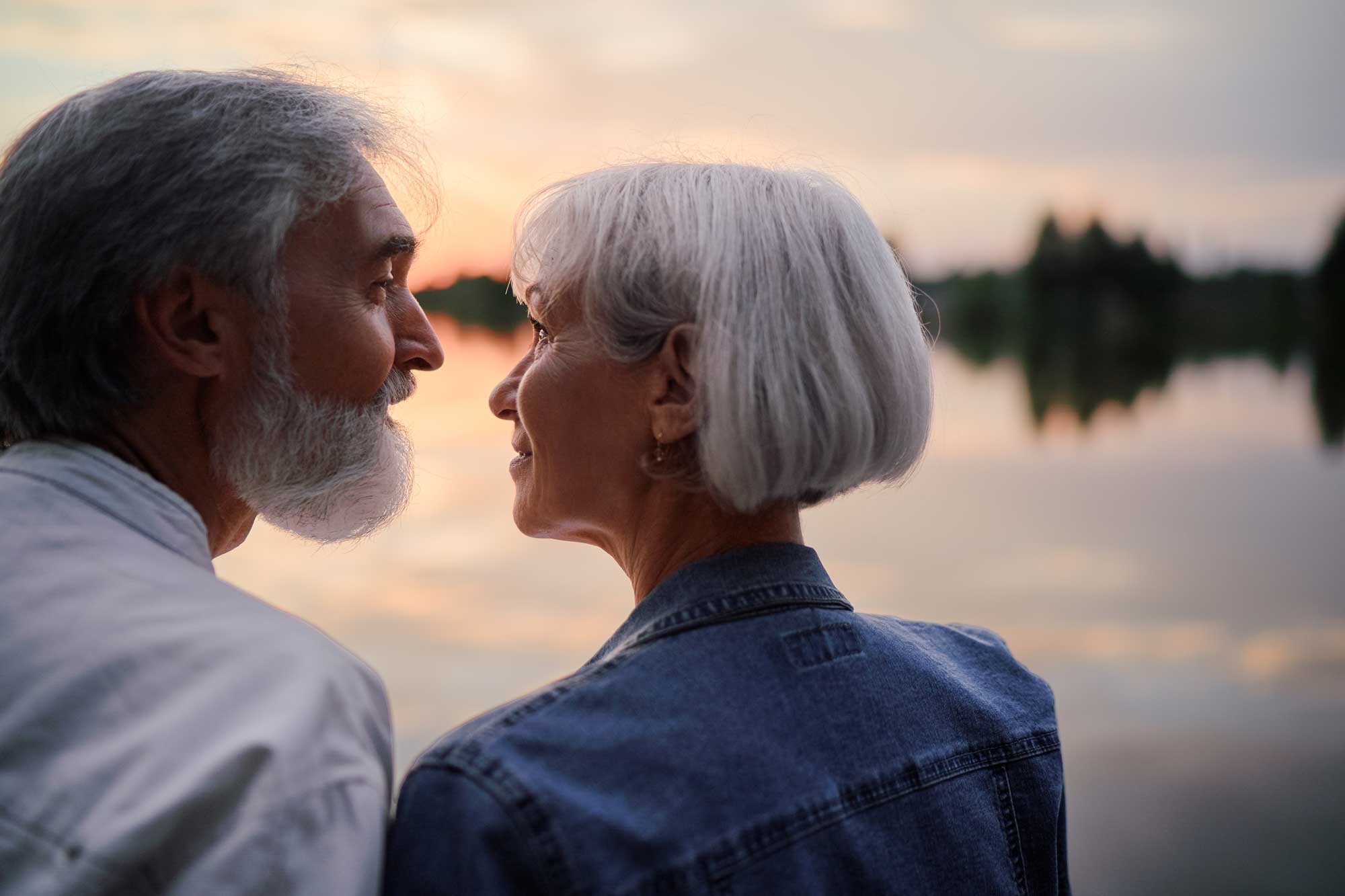 retired couple by lake